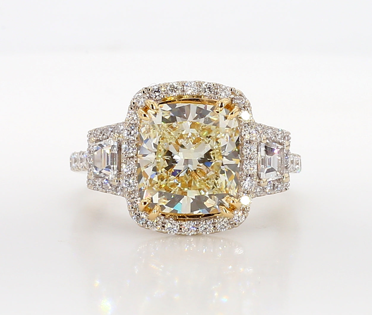 fancy light yellow cushion 3 stone diamond ring 5.05 carat
