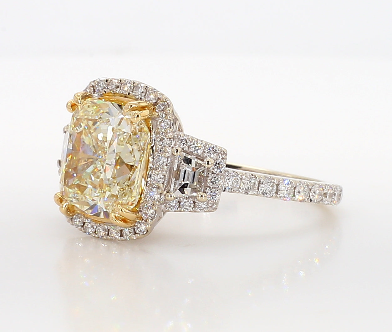 fancy light yellow cushion 3 stone diamond ring 5.05 carat