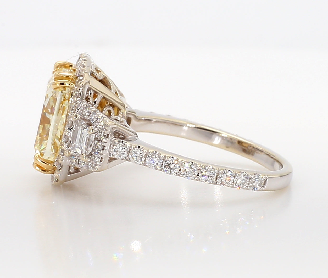 fancy light yellow cushion 3 stone diamond ring 5.05 carat