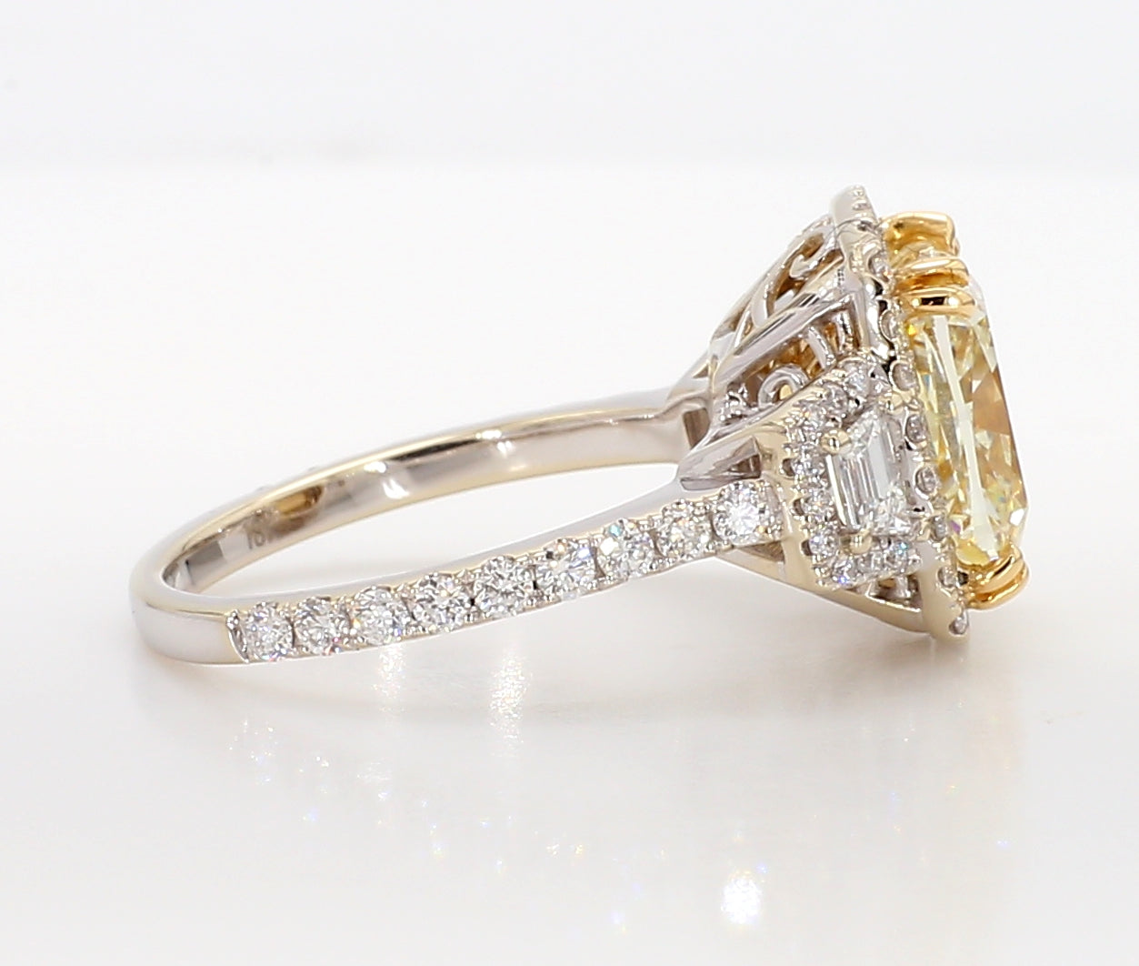 fancy light yellow cushion 3 stone diamond ring 5.05 carat