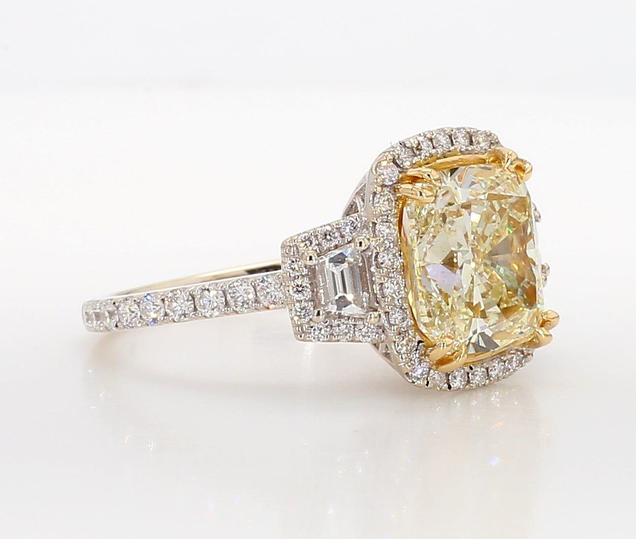 fancy light yellow cushion 3 stone diamond ring 5.05 carat