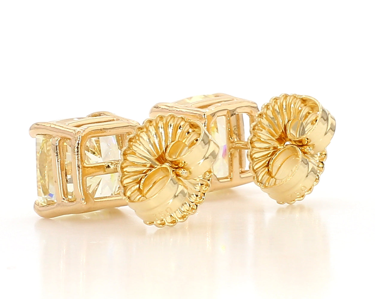 exceptional fancy light yellow cushion studs 6.04 carat
