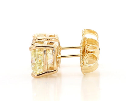 Exceptional Fancy Light Yellow Cushion studs   6.04 Carat