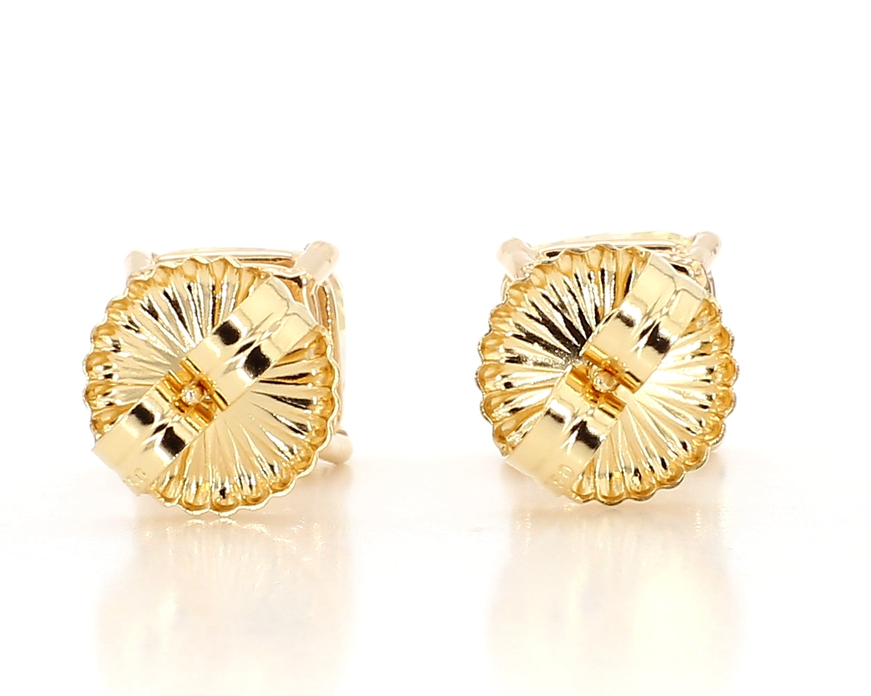 exceptional fancy light yellow cushion studs   6.04 carat