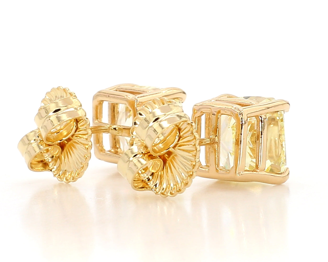 exceptional fancy light yellow cushion studs   6.04 carat