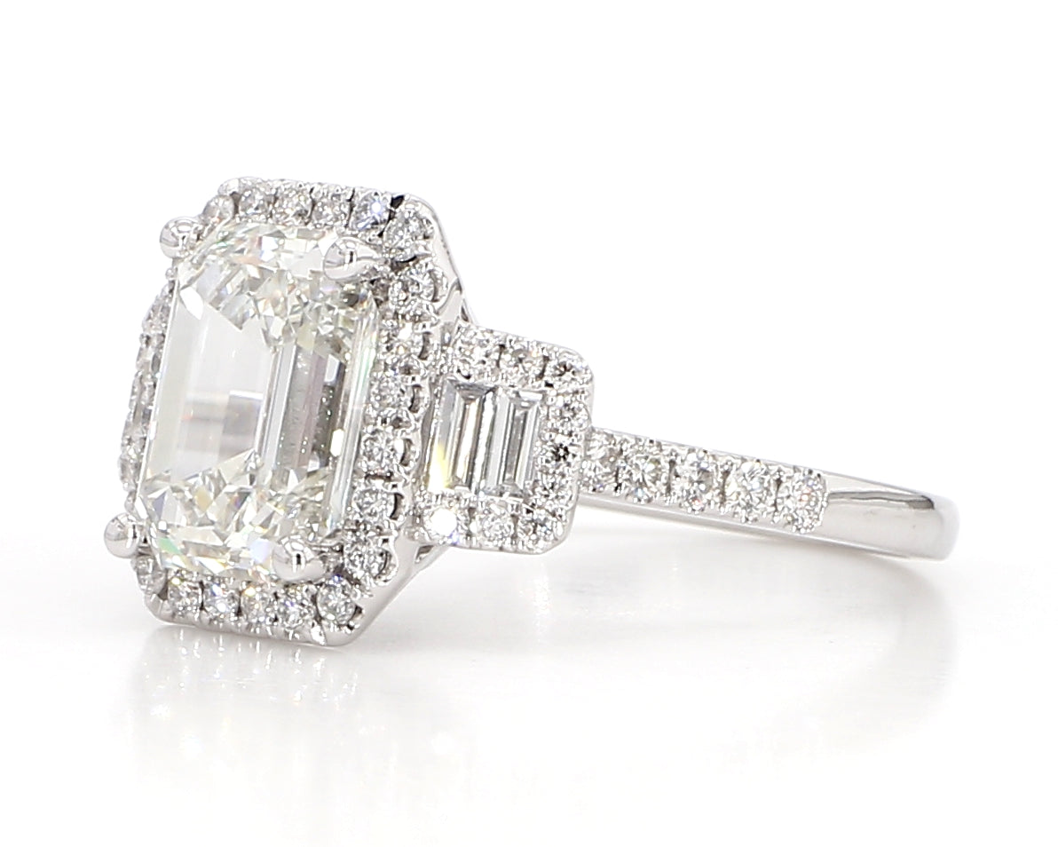 exceptional emerald cut 3 stone diamond double halo ring  3.75 carat