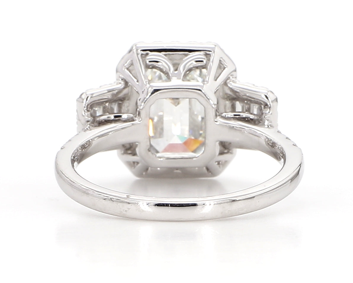 exceptional emerald cut 3 stone diamond double halo ring  3.75 carat