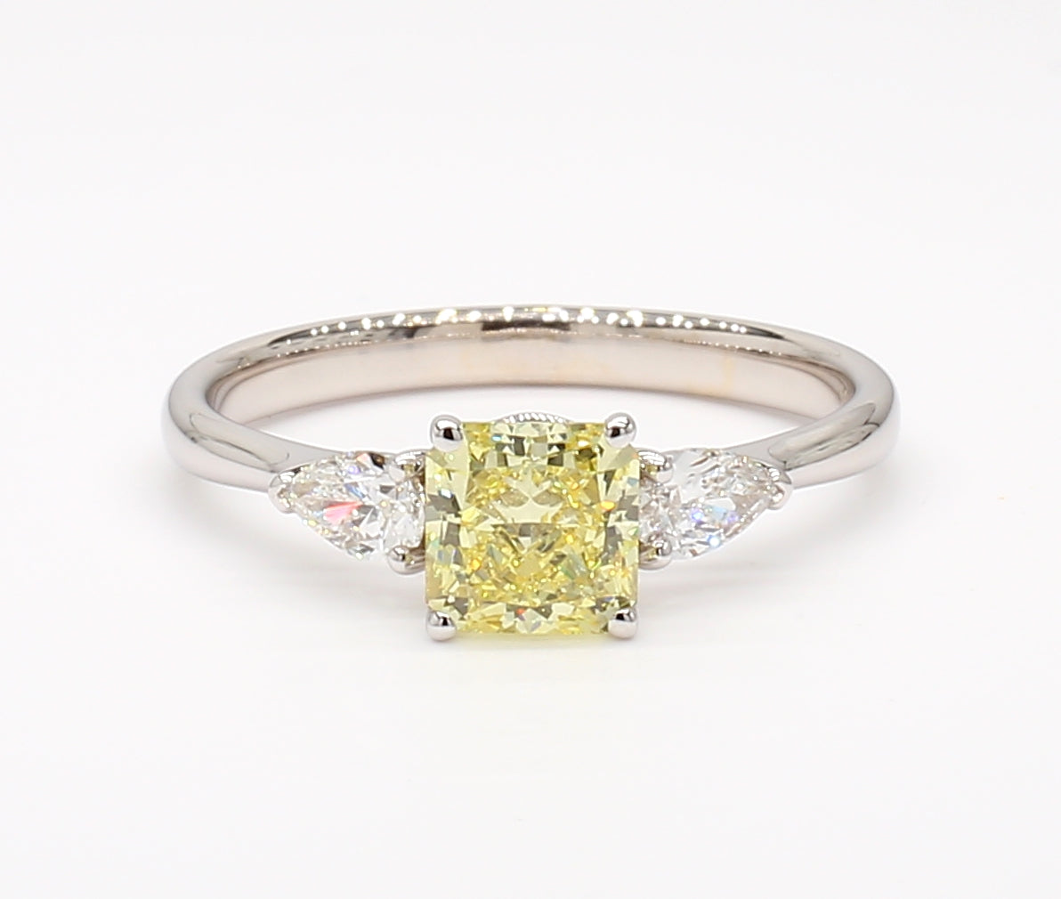 fancy intense yellow cushion diamond 3 stone ring  1.06 carat